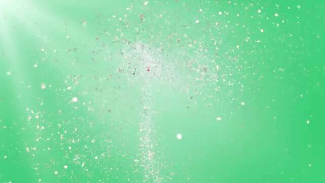 Particles forming then dissolving into glitter and light rays, effect for video background or chroma key footage