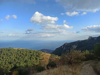beautiful green mountain landscape with clouds upper them. autumn time. Crimea