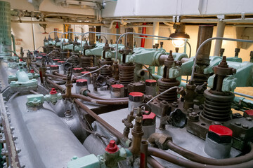 Engine room machinery details showcasing intricate components of a vintage marine engine at a historical vessel location