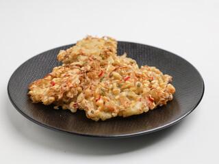 Vegetable fritters on white background