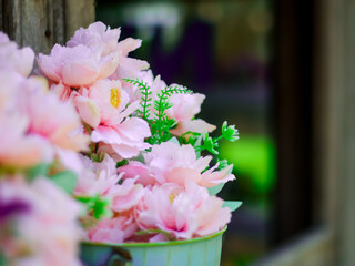 Flowers in a vase on the background of a wooden door