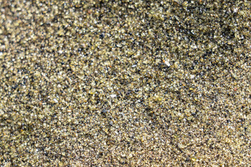 Close view of olivine-rich sand found on the beach. Papakōlea Beach (also known as Green Sand Beach or Mahana Beach is a green sand beach located near South Point, in the Kaʻū district of  Big island