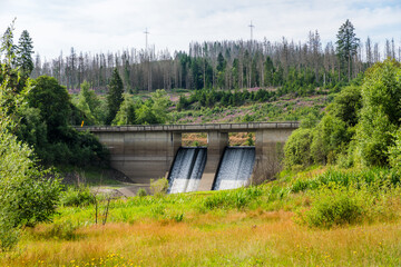 Fototapeta premium Overflowing Dam at Oker Reservoir in Summer, Harz Mountains