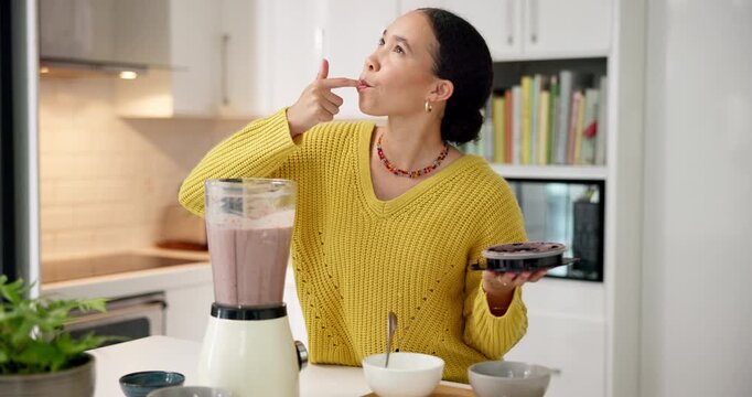 Woman, blender and taste with lick, smoothie and test flavor with healthy drink for nutrition in home. Person, diet and appliance for milkshake, weight loss or wellness in kitchen at apartment