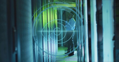 Mid adult African American technician examining server rack in data center, with HUD overlay