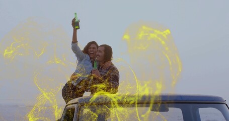 Laughing couple sitting on SUV roof at seaside, holding green bottles with yellow overlay