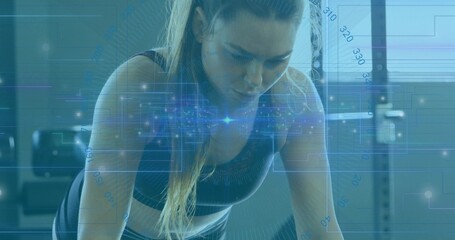 Leaning athlete wearing sports bra, leggings, holding plank on mat in gym, with data overlays