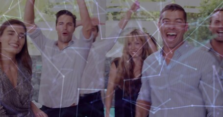 Cheering colleagues raising arms in business casual on balcony with glass railing network overlay