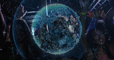 Dancing crowd raising hands at dark music venue with holographic globe and laser lights