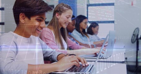 Typing teenage boy in grey shirt at laptop in computer lab, with data overlays, copy space