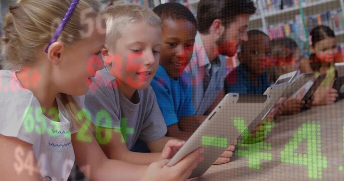 Assisting teacher in blazer guiding children using tablets at library table with bookshelves - Powered by Adobe