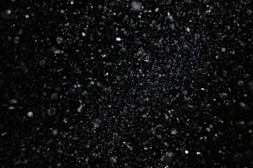 Obraz premium Abstract Sparkling Light Dust Particles Suspended in Space for Creative Designs and Artwork