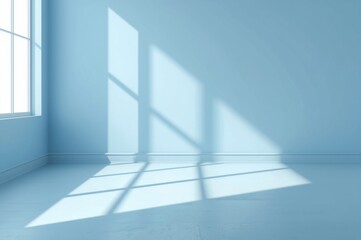 Obraz premium Minimalist blue room illuminated by window light casting geometric shadows on the wall
