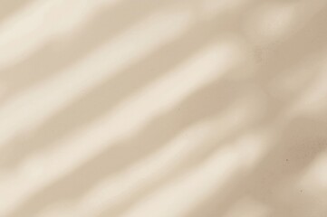 Sophisticated light beige surface accentuated by intriguing shadow patterns for serene ambiance