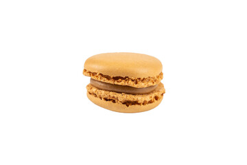 Single caramel macaron close-up. A caramel-colored macaron with a rich cream filling. Its crispy shell contrasts with the smooth filling. Macaron on a transparent background.