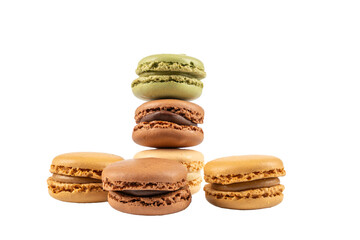 Macarons pyramid six pieces. A stack of colorful macarons in green, brown, beige, and caramel tones. Arranged in a small pyramid on white background. Macaron on a transparent background.