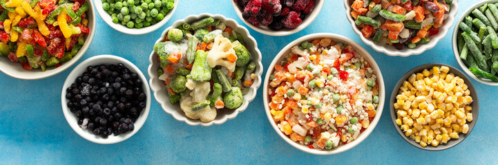 A top view of colorful, frozen vegetables on plates, highlighting the process of preserving summer...