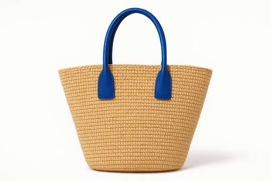 Natural raffia tote with vibrant cobalt blue leather handles, woven texture and clean modern beach style