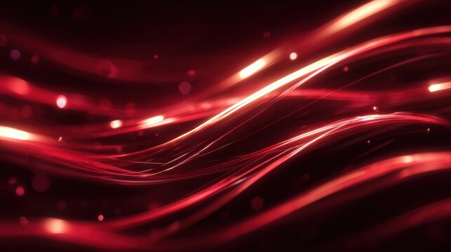 Dynamic red light streaks and bokeh create a vibrant, energetic abstract background perfect for modern design and technology visuals.
