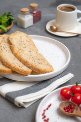 Cheesecakes with different berries on a light plate on a gray table