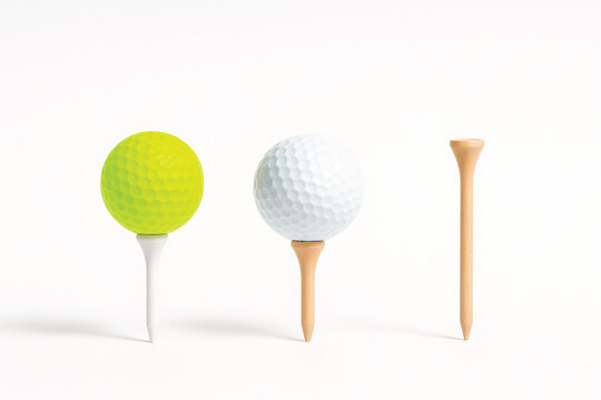 Golf Balls and Tees on White Background Keywords: golf, golf ball, golf tee, sport, recreation