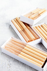 cigarette casings, packed in boxes, on the table, top view,