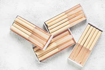 cigarette casings, packed in boxes, on the table, top view,