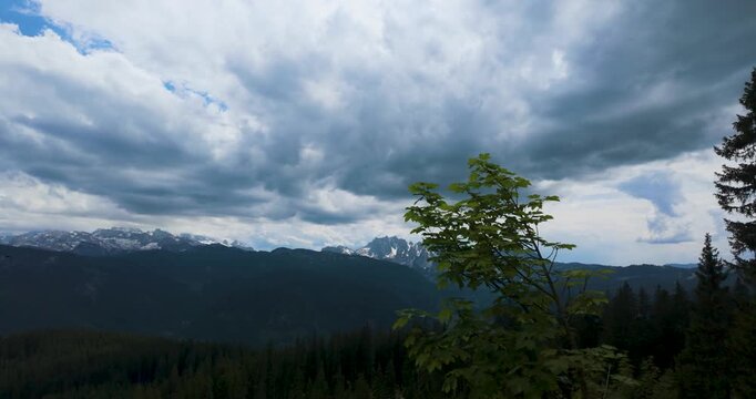Dramatic Sky Over Dachstein Mountains with Forest Foreground in Gosau Austria