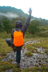 A hiker doing a yoga pose in the wild at Mount Napak in Uganda