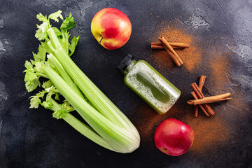 Celery Apple cinnamon fresh pressed juice concept, top view