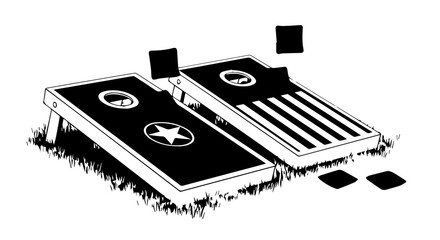 Two Black Cornhole Boards with Star and Stripe Designs on Grassy Surface.