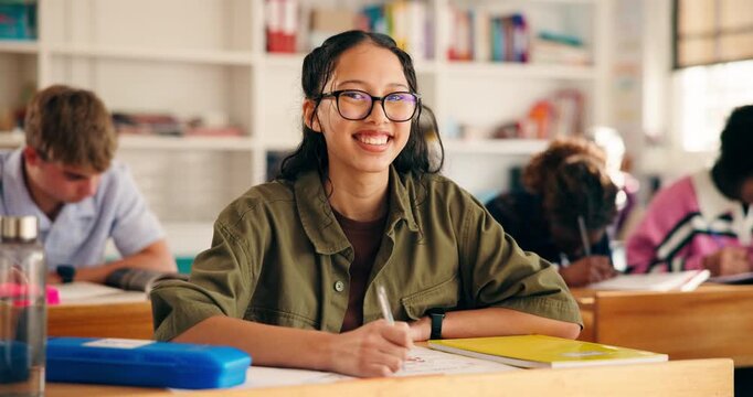 Happy, face and student in high school with writing test, exam or assessment for education. Smile, learning and portrait of girl teenager with books for notes for studying in classroom at campus.