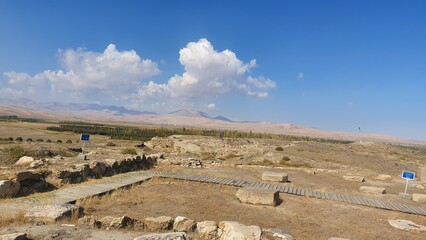 Hasanlu Tepe archaeological mound in West Azerbaijan, Iran — ancient citadel ruins, mud-brick walls, and excavated terraces under blue sky  a timeless Persian heritage landscape and archaeology concep © Mehr