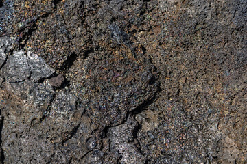 volcanic rocks / Lava have rainbow colors on their surface. Puna Basalt Lava flows, A.D. 1974. Keanakako'i Overlook. Hawaiʻi Volcanoes National Park.