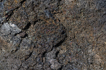 volcanic rocks / Lava have rainbow colors on their surface. Puna Basalt Lava flows, A.D. 1974. Keanakako'i Overlook. Hawaiʻi Volcanoes National Park.