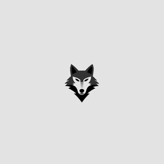 Obraz premium Geometric minimalist wolf head logo vector illustration in black and white, depicting a wild animal icon or emblem design.