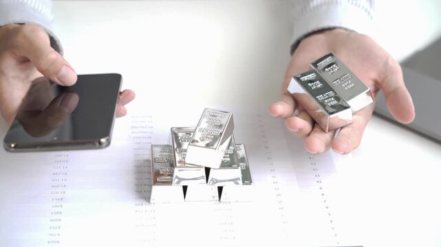 Silver Trading Businessman invest in trading silver, calculating profit price of silver in the market.