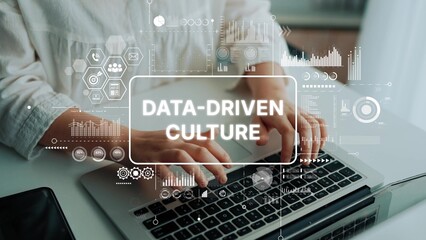 Hands Typing on Laptop with Data-Driven Culture Infographic and Digital Elements in Modern Workspace. Asymptotic smart data analytic.