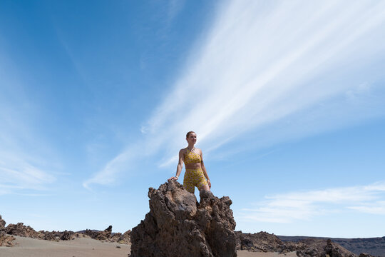 Woman hiking volcano landscape finding freedom - Powered by Adobe