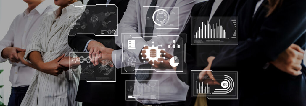 A diverse business team collaborates in a modern office setting, focusing on innovative data analysis through digital graphics that enhance insights and drive success. Trope