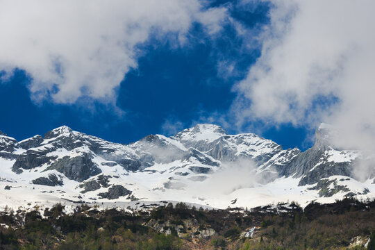 First snow falls on the mountains of Val Masino, Sondrio Province, Italy.