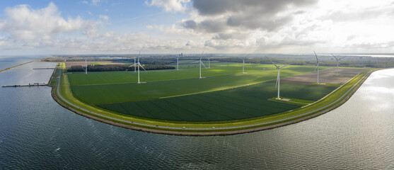 Aerial view on energy farm with wind mills generating sustainable green electricity in Flevoland, the Netherlands