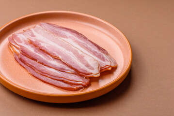 Meat, raw pork bacon sliced, organic food, protein for snacks. Raw bacon as a background