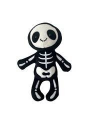 Adorable black and white skeleton plush toy with smiling face. Halloween or kids toy concept with funny spooky design.