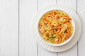 yummy spaghetti with shrimps in a white bowl