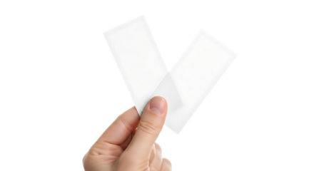 Hand holding two blank white rectangular paper or plastic strips isolated on transparent background