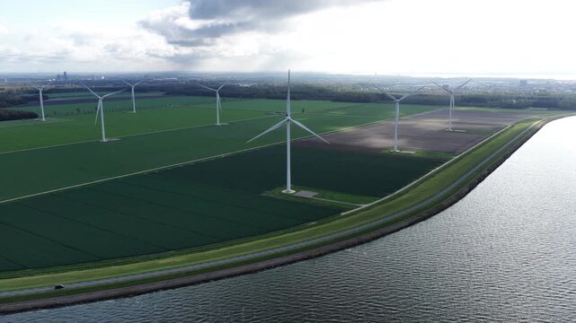 Aerial view on energy farm with wind mills generating sustainable green electricity in Flevoland, the Netherlands
