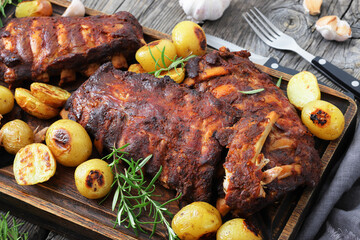 bbq baby pork ribs with potatoes, fresh rosemary