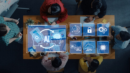 A diverse team collaborates on artificial intelligence strategies in a modern workspace, surrounded by digital graphics, showcasing teamwork and innovation in action. Trope