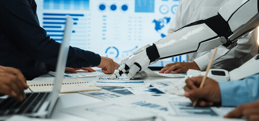 A dynamic business meeting demonstrating collaboration between humans and a robot, highlighting the...